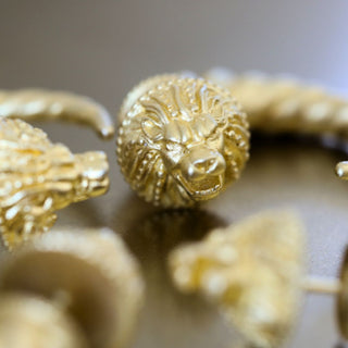 gold plated lion earrings